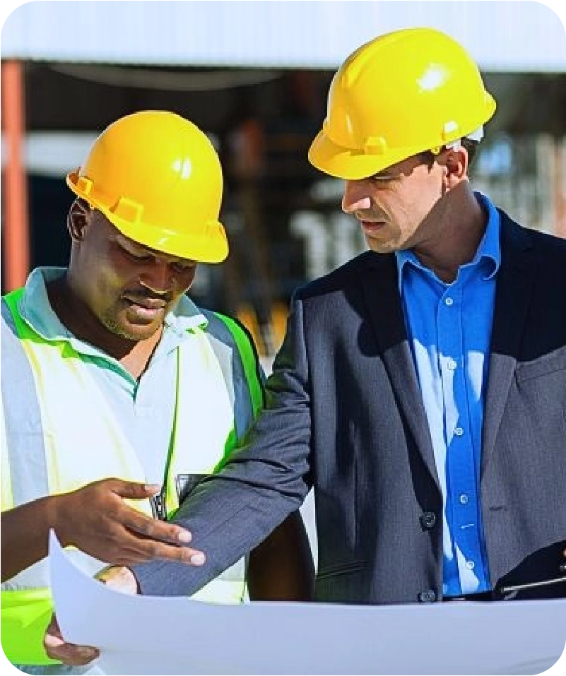 Group of male architect and construction workers on construction site.