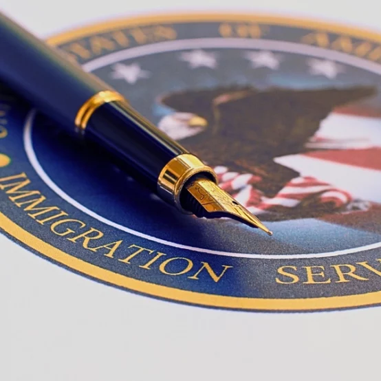 Immigration Services Center logo with a fountain pen. Who Qualifies for a Waiver of Inadmissibility