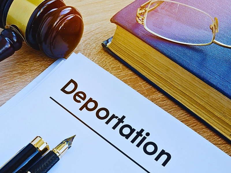 Deportation and other documents on a desk. deportation bond hearing