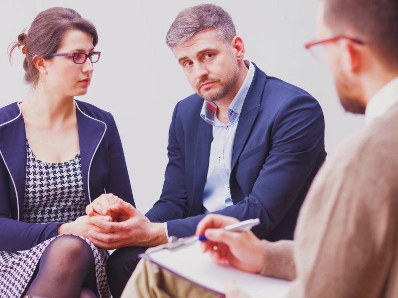What Happens After a Stokes Interview? Timeline, Possible Outcomes, and Next Steps 1 A serious couple holding hands during a therapy session. after a Stokes interview